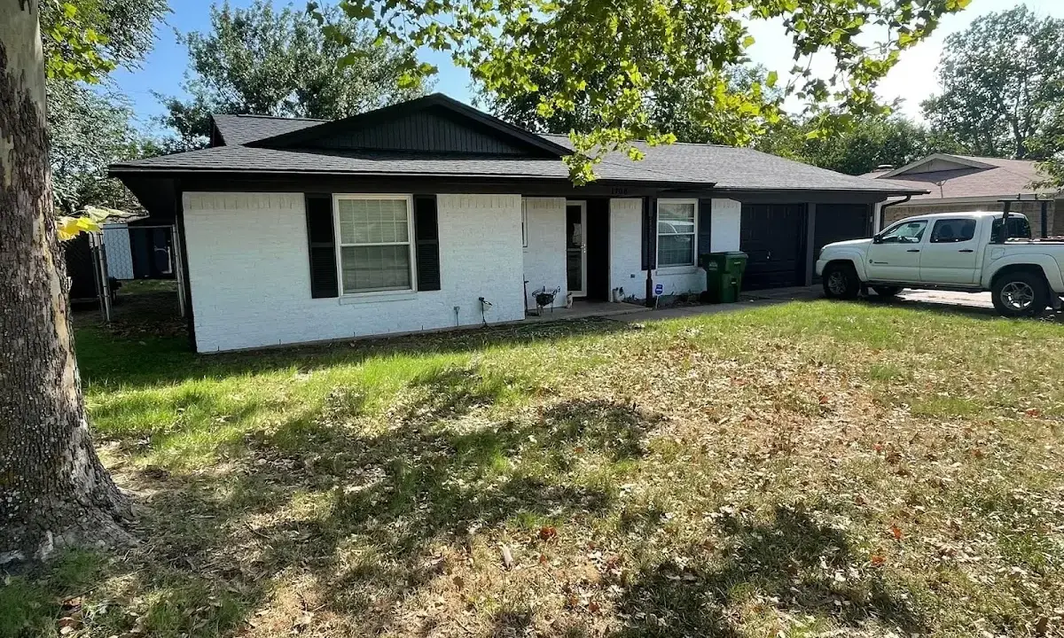 Professional roofing crew working on a residential roof in Aberdeen